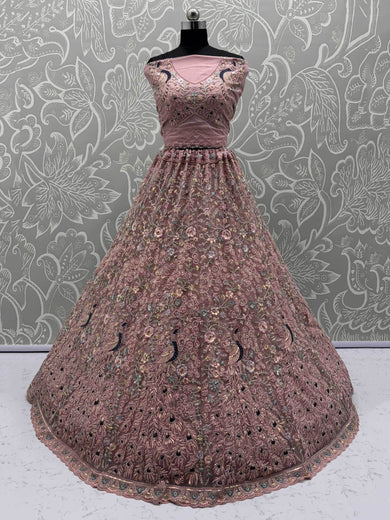 Magnetic Peach Net Sequins Wedding Wear Lehenga Choli With Dupatta